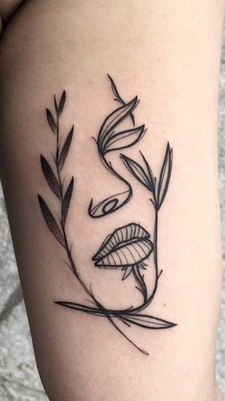 Leaf On Face Tattoo